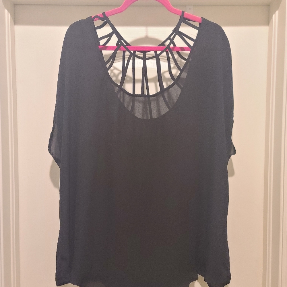 Cute Torrid top with cage neck line